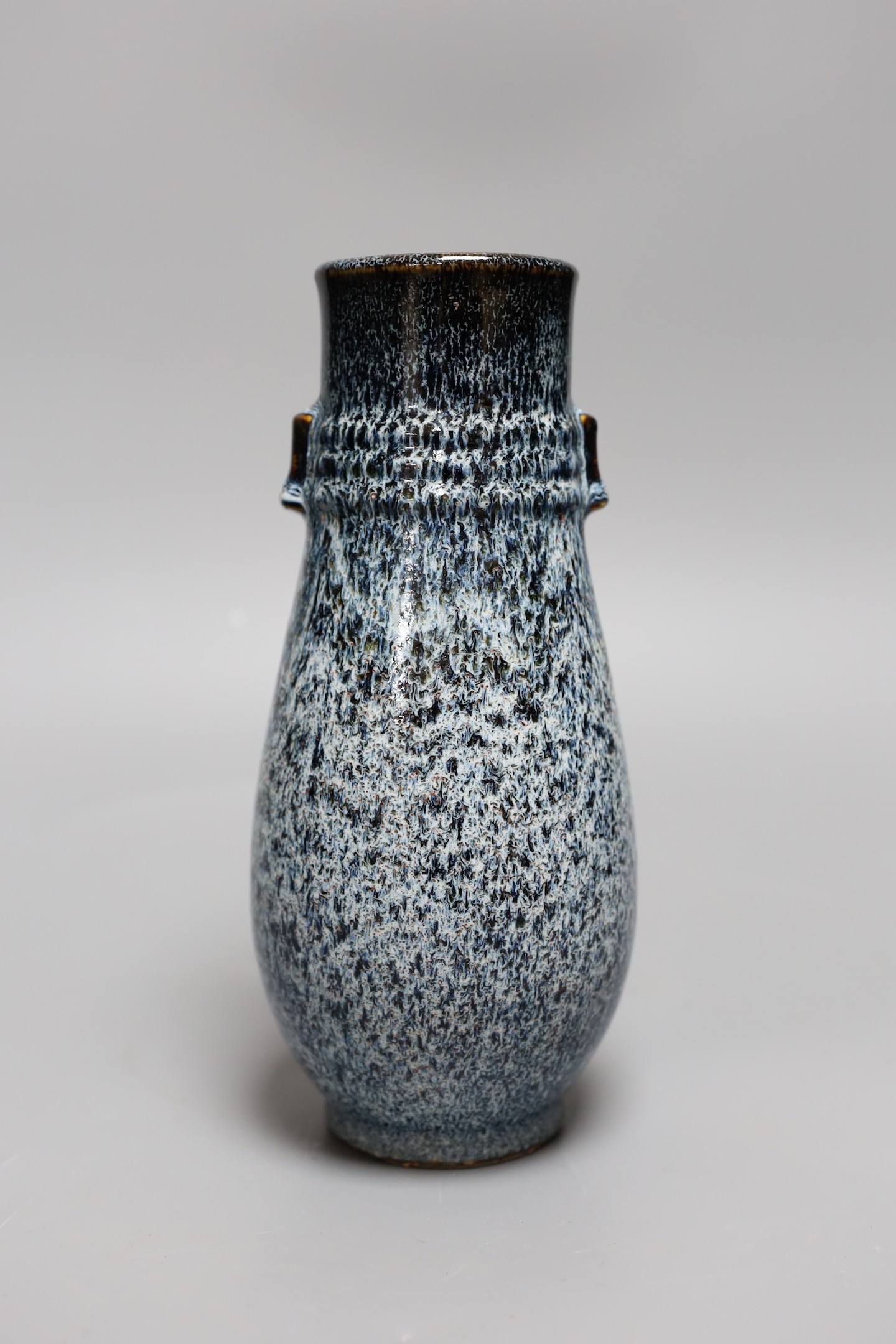 A Chinese Shiwan vase, 23 cms high